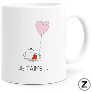 White mug with a small cartoon dog holding a pink heart-shaped balloon and the caption 'JE T'AIME …'