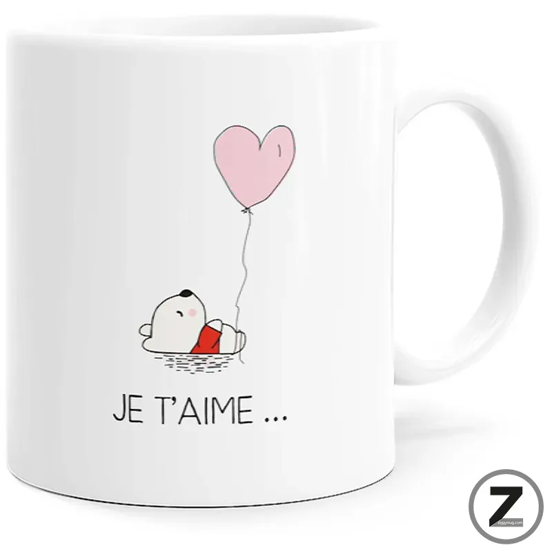 White mug with a small cartoon dog holding a pink heart-shaped balloon and the caption 'JE T'AIME …'