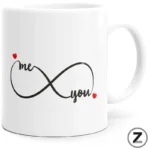 White ceramic mug featuring a black infinity symbol with the words 'me' and 'you' and small red hearts on each end, symbolizing eternal love.
