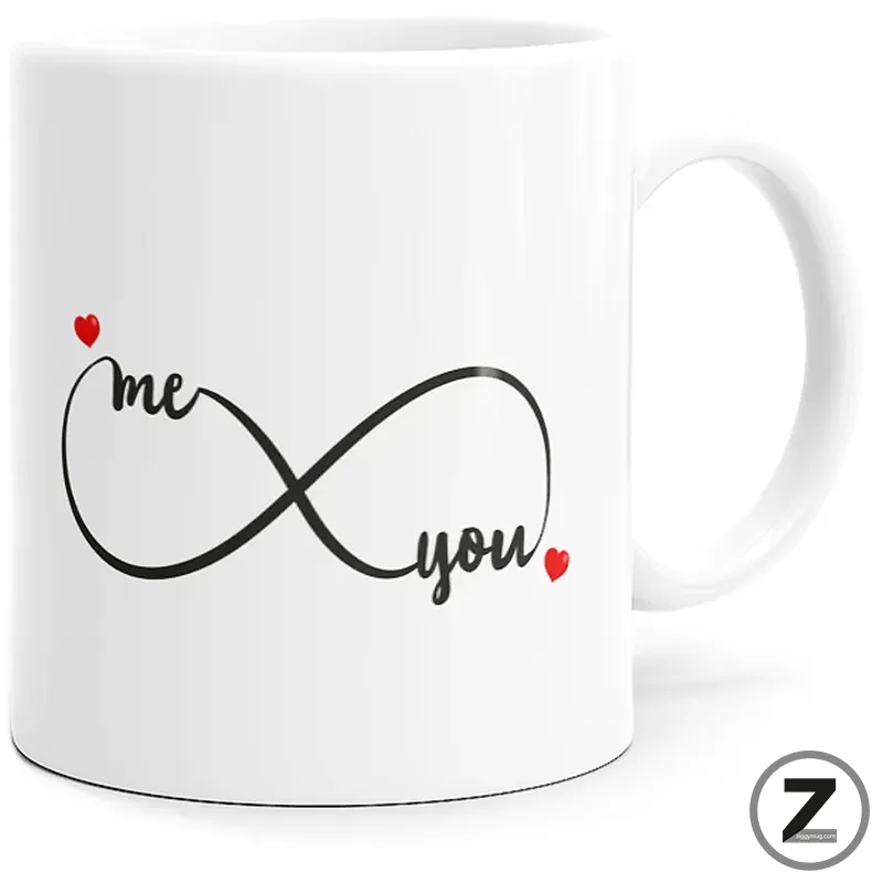 White ceramic mug featuring a black infinity symbol with the words 'me' and 'you' and small red hearts on each end, symbolizing eternal love.
