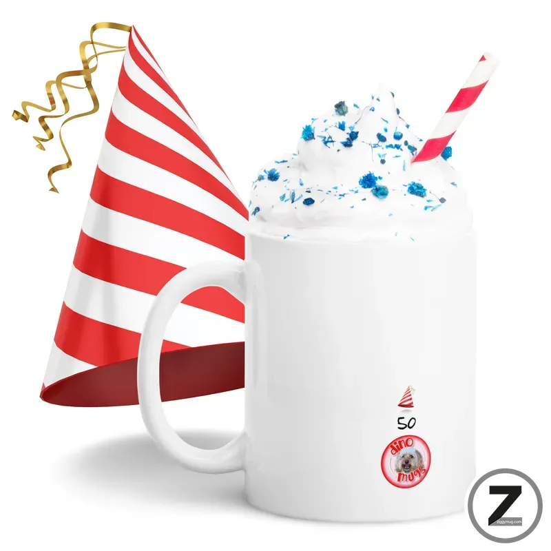 White mug filled with whipped cream and blue sprinkles, a red-and-white striped party hat leaning beside it, and a red striped straw; birthday celebration theme (50th).