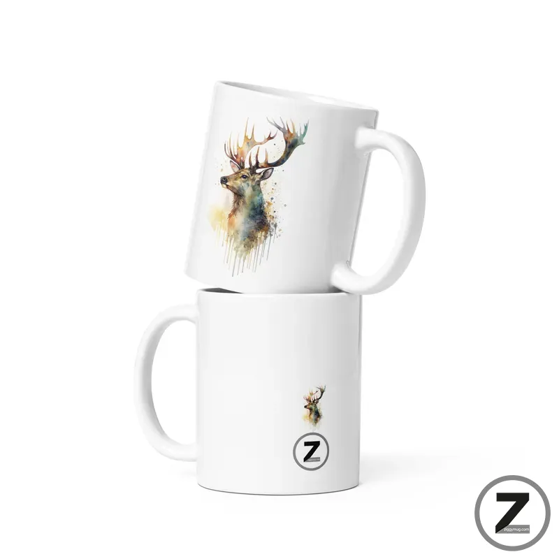 Two white ceramic mugs stacked, each with watercolor deer artwork; bottom mug shows a small deer and a Z logo badge.