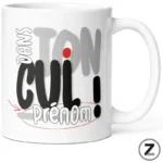White mug with bold, overlapping typography forming a name graphic; includes 'prenom' and a red dot, with a small Z-brand mark.