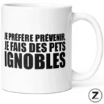 White mug with bold black French text: 'JE PRÉFÈRE PRÉVENIR, JE FAIS DES PETS IGNOBLES'.