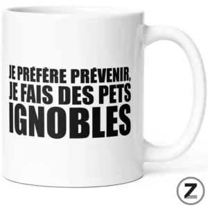 White mug with bold black French text: 'JE PRÉFÈRE PRÉVENIR, JE FAIS DES PETS IGNOBLES'.
