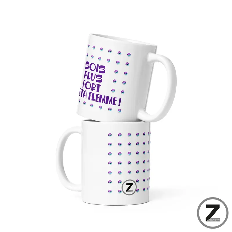 Two white ceramic mugs stacked, decorated with a purple dotted pattern and a bold French slogan.