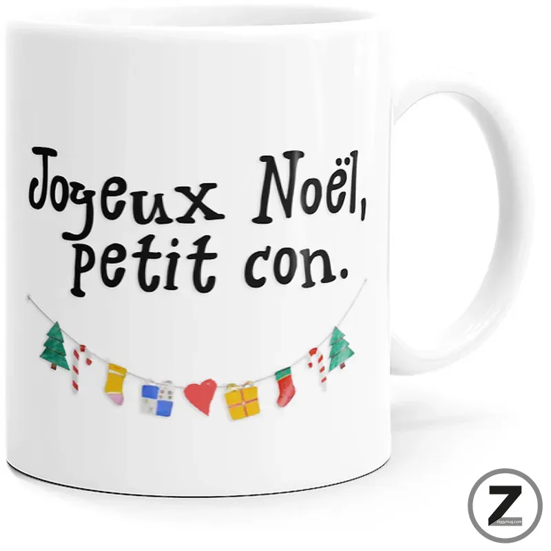 White ceramic mug showing the French Christmas message 'Joyeux Noël, petit con.' with a small decorative garland under the text to the left.