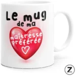 White ceramic mug featuring a red heart and the French phrase 'Le mug de ma maîtresse préférée'.