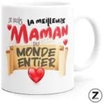 White mug with a colorful French message declaring 'Je suis la meilleure maman du monde entier' and red hearts on a parchment banner motif.