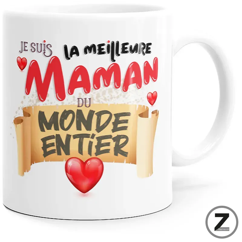 White mug with a colorful French message declaring 'Je suis la meilleure maman du monde entier' and red hearts on a parchment banner motif.