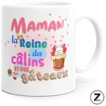 White mug with a colorful French phrase—“Maman la Reine des câlins et des gâteaux”—and cute cupcakes, hearts, and a sleepy cat graphic on a white background.