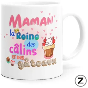 White mug with a colorful French phrase—“Maman la Reine des câlins et des gâteaux”—and cute cupcakes, hearts, and a sleepy cat graphic on a white background.
