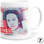 White ceramic mug featuring a pop-art style portrait of a woman with a bold red text banner in the lower-left corner.