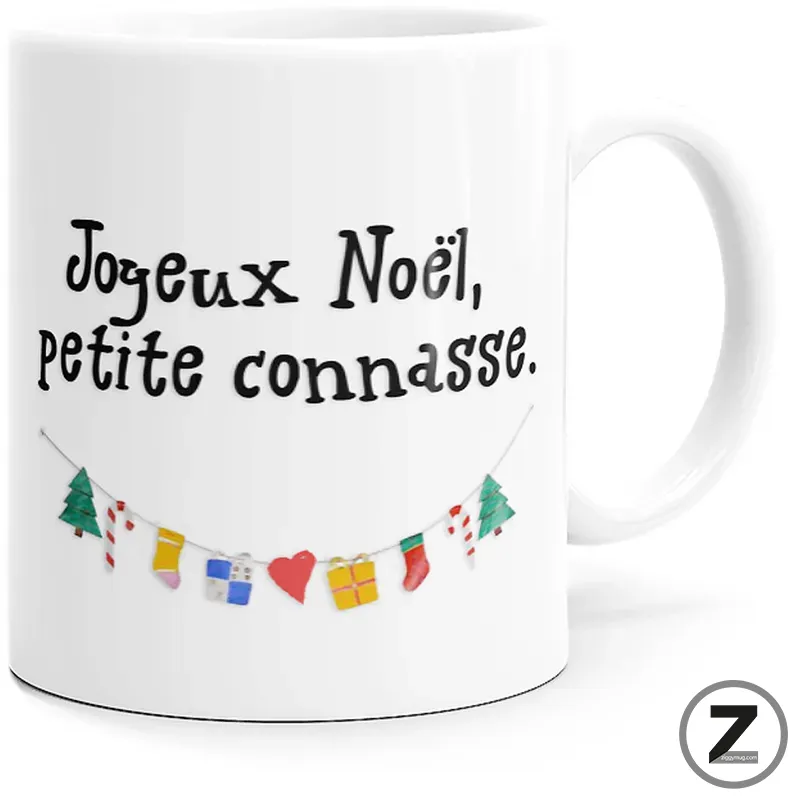 White mug featuring the handwritten French message 'Joyeux Noël, petite connasse.' above a small garland of colorful holiday icons (trees, stockings, hearts).
