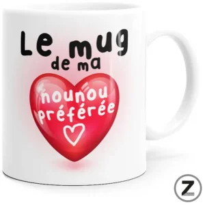 White ceramic mug featuring a pink heart graphic and the French text 'Le mug de ma nounou préférée' (my nanny's favorite mug).