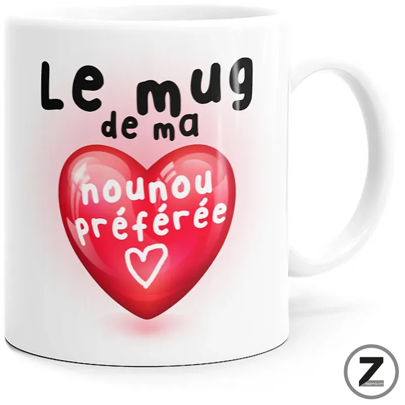 White ceramic mug featuring a pink heart graphic and the French text 'Le mug de ma nounou préférée' (my nanny's favorite mug).