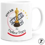 Mug with a gold Oscar statue, film reels, and the French text 'Oscars du Meilleur Papa' showing a Best Dad gift motif.