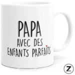 White ceramic mug with the French phrase 'Papa avec des enfants parfaits' and a small red heart.