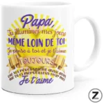 White mug with a bright yellow sunburst and purple/pink French message expressing love to dad.