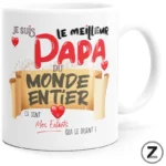 Mug with a colorful French message declaring 'I am the best dad in the world' surrounded by hearts and banners. It reads: 'Je suis le meilleur papa du monde entier' and 'Mes enfants qui le disent !'