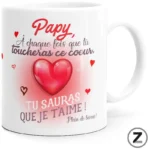 White mug with a pink heart and French message for grandpa: 'Papy, A chaque fois que tu toucheras ce cœur, tu sauras que je t'aime!' with small red hearts around it.