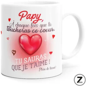 White mug with a pink heart and French message for grandpa: 'Papy, A chaque fois que tu toucheras ce cœur, tu sauras que je t'aime!' with small red hearts around it.