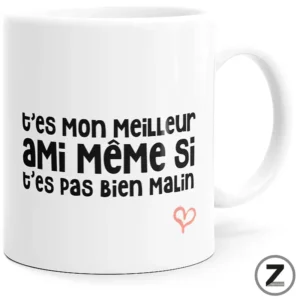 White ceramic mug displaying a humorous French phrase in black text with a small pink heart drawing nearby: 't'es mon meilleur ami même si t'es pas bien malin'