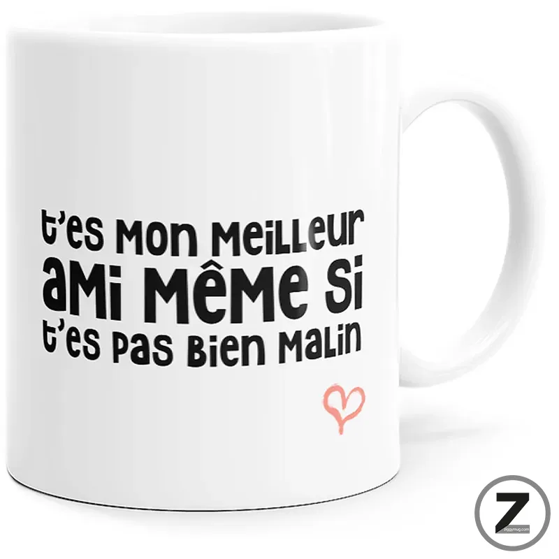 White ceramic mug displaying a humorous French phrase in black text with a small pink heart drawing nearby: 't'es mon meilleur ami même si t'es pas bien malin'