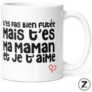 White ceramic mug featuring a bold black French phrase: t’es pas bien foutée mais t’es ma maman et je t’aime, with a small red heart.