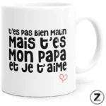 White mug with bold French text: "t'es pas bien malin, mais t'es mon papa et je t'aime" and a small pink heart.