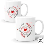 Two white ceramic mugs featuring a love-themed spiral pattern with red hearts and phrases like 'je t'aime' in black/red text.