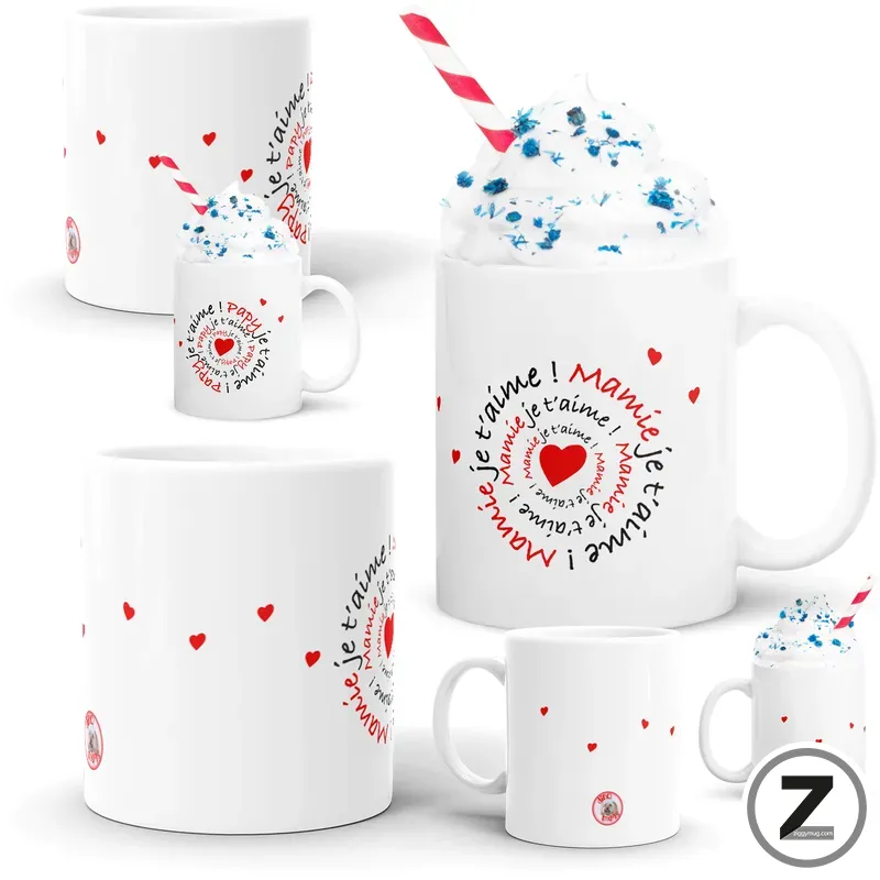 Set of white ceramic mugs with red hearts and circular 'je t'aime' text motif, arranged around a central mug with blue sprinkles and a striped straw (valentine design).